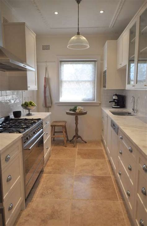 Cedar cabinets make galley kitchen gleam. Galley style kitchen | Kitchen flooring, Best flooring for ...