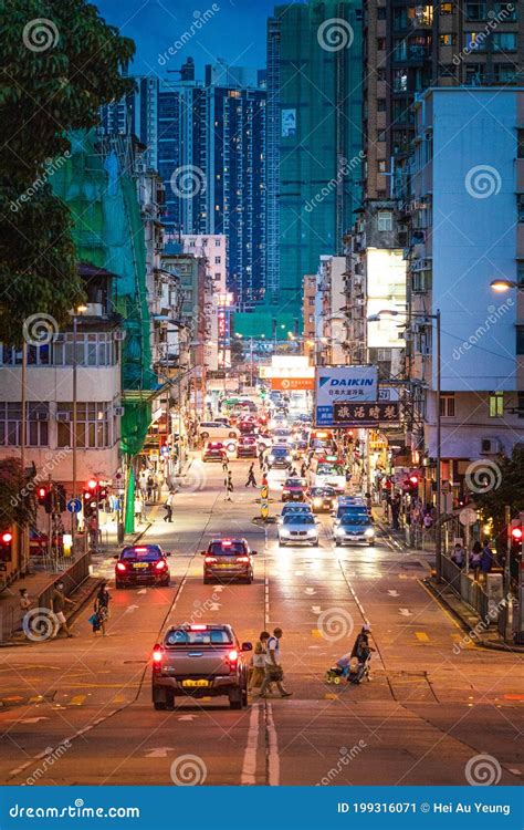Kowloon City Night Of Busy Street Many People And Cars Downtown Of