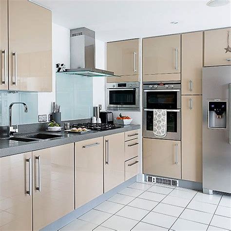 Pale Modern Kitchen Units With Glass Splashbacks And White Tiled Floors
