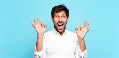 Premium Photo Young Handsome Indian Man Surprised Expression