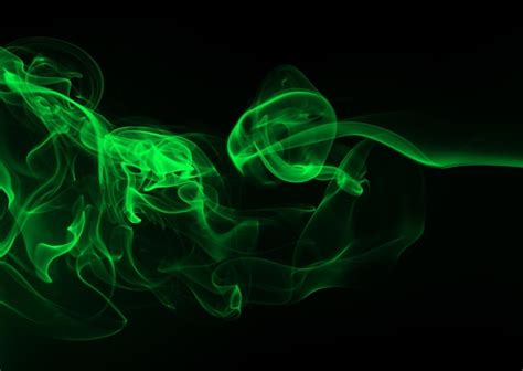 Premium Photo Green Smoke Abstract On Black Background For Design