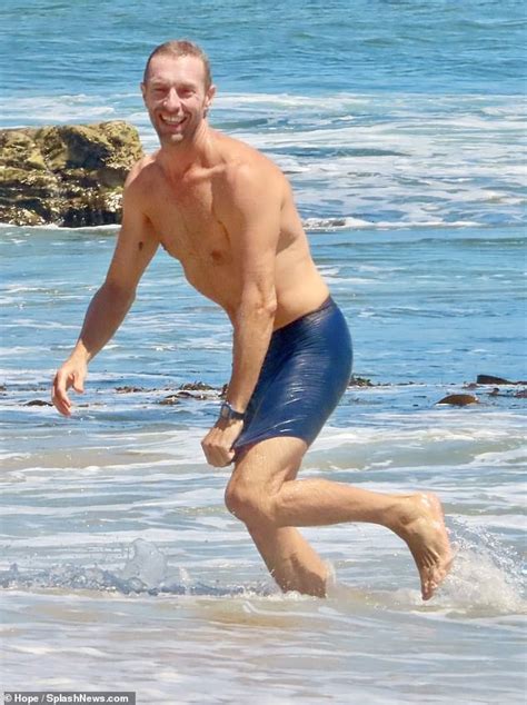 Shirtless Chris Martin Shows Off His Hunky Frame While Going For A Swim