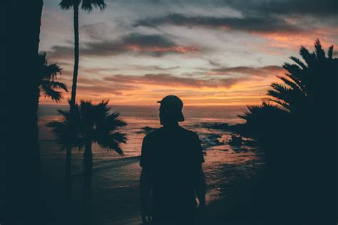 guy looking into the sunset people images ~ creative market