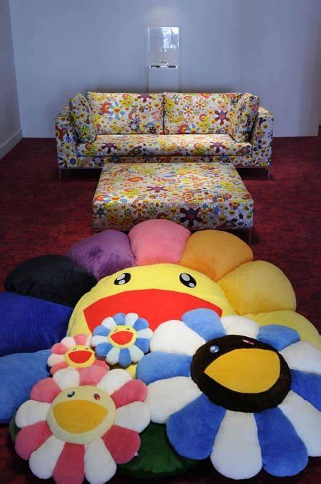 The double sided cushion features a happy smiling murakami flower on the front and a sleepy murakami flower on the reverse. this giant rainbow murakami flower would complete my life ...