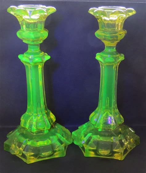 Yes, canary glass, uranium glass, or vaseline glass, as it became known in the early 20th century for its similar color to petroleum jelly, emits radiation, but the amounts are tiny, infinitesimal, ridiculously small. Uranium Glass Candlesticks | Collectors Weekly