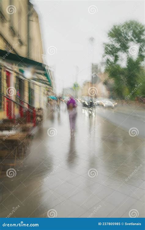 Girl Under An Umbrella Going In Rain City Street Wet Sidewalk