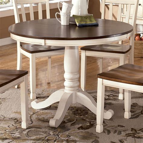 Includes 1 coffee table and 2 end tables. Signature Design by Ashley Whitesburg Two-Tone Round Table ...
