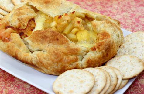 Brie wrapped in puff pastry and baked until it has thoroughly melted inside is one of the world's easiest yet tastiest appetizers. Dalia's Delights: Baked Brie in Puff Pastry with Apple Compote