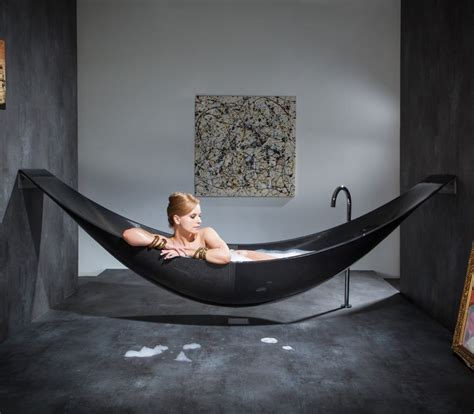 Toddlers discover fun in the mundane activity of bathing by making their tub a mini playground. Vessel - Hammock Shaped Bathtub by SplinterWorks