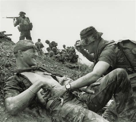A Medic Attends A Wounded Special Forces Soldier As South Vietnamese