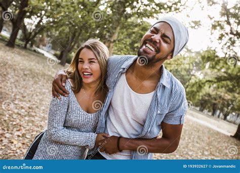 Portrait Of Romantic And Happy Mixed Race Young Couple In Park Stock Image Image Of Girlfriend