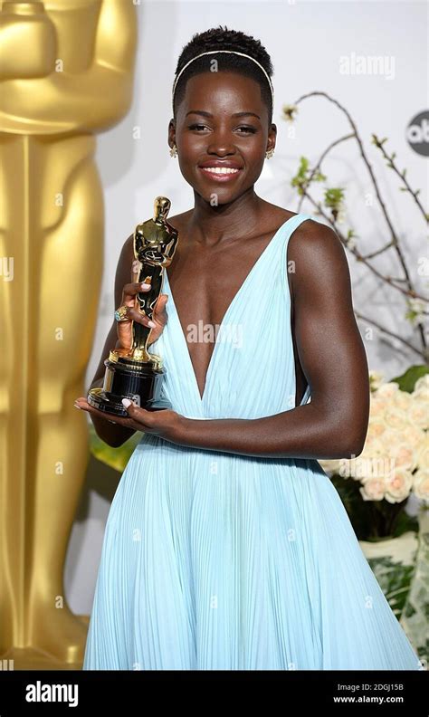 Lupita Nyong O With The Academy Award For Best Supporting Actress For Years A Slave In The