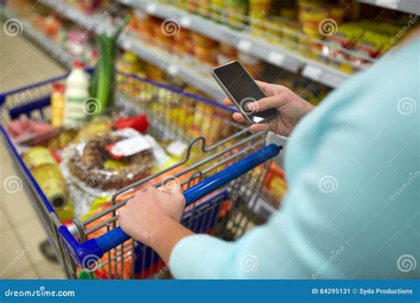 Woman With Smartphone Buying Food At Supermarket Stock Image Image Of