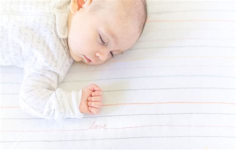 Sleeping sweet baby wearing funny striped stock photo. Sweet Baby Sleeping In A Crib Stock Photo - Download Image ...