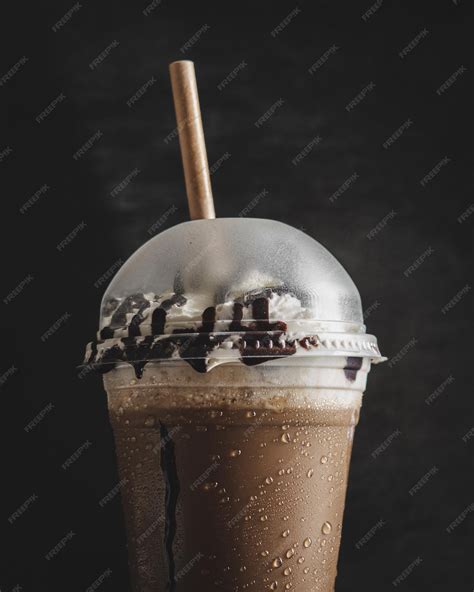 Premium Photo Closeup Shot Of A Dark Chocolate Frappe On A Black