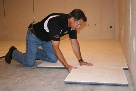 The tiles snap together in a stack bond or running bond pattern providing a vapor barrier with a 1/4 air space between the concrete. ThermalDry® Insulated Floor Decking | Basement Subfloor System