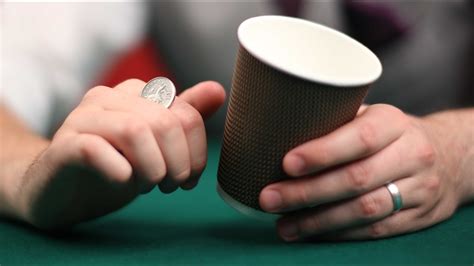 Watch this video to learn how to do a magic trick! How to perform the coin in the cup magic trick | Magic ...