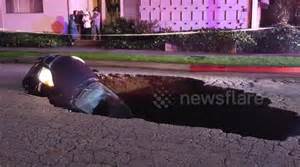 Sinkhole Swallows Two Cars With Driver Still Inside Buy Sell Or