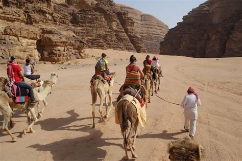 This video is information about the nature , rajasthani camel rides , sand dunes, camel carts and happy tourists.amazing place.watch the video and you will. That one time I fell off a camel in Jordan - Young Adventuress