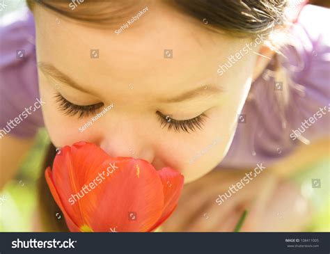 Portrait Cute Little Girl Smelling Flowers Stock Photo 108411005