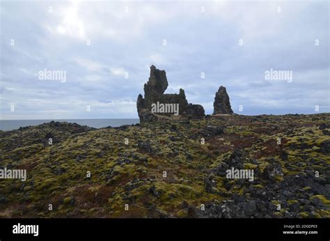 Beautiful Landscape With Moss Covered Lava Rock And Londrangar Rock