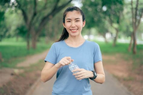 Premium Photo Asian Women Drink Water After Exercising