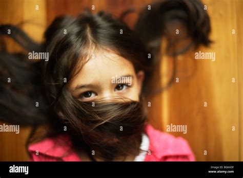 Girl Six Years Old With Hair Across Face Stock Photo Alamy