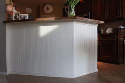 How to install wainscoting around door openings. how to add beadboard to kitchen island! she did this for ...