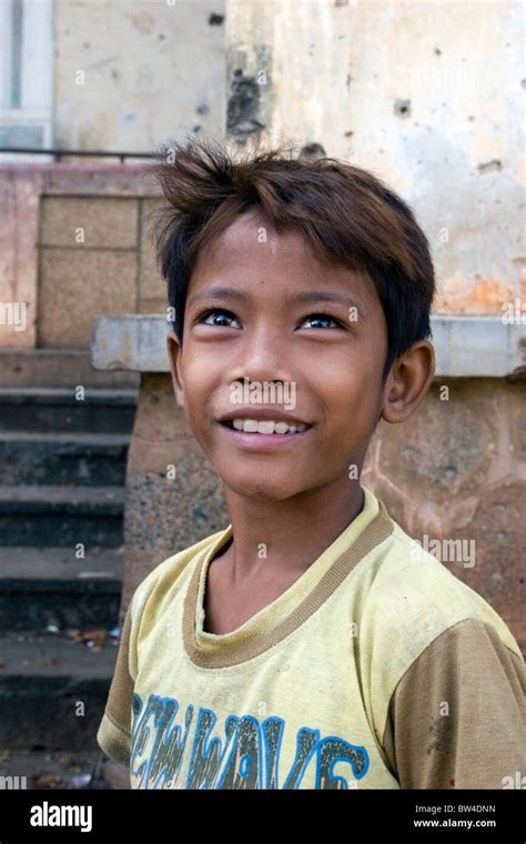 A 9 Year Old Boy Poses For A Portrait At Wat Bangkok In Kampong Cham