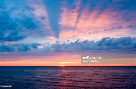 Pink And Blue Sunset With Clouds Over Lake Erie High Res Stock Photo