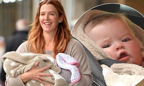 beaming poppy montgomery shows off gorgeous lookalike daughter violet during first public outing