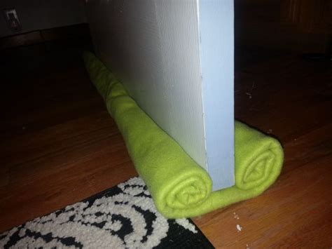 Diy Door Draft Stopper Simply Roll Fabric Or Blanket And Safety Pin
