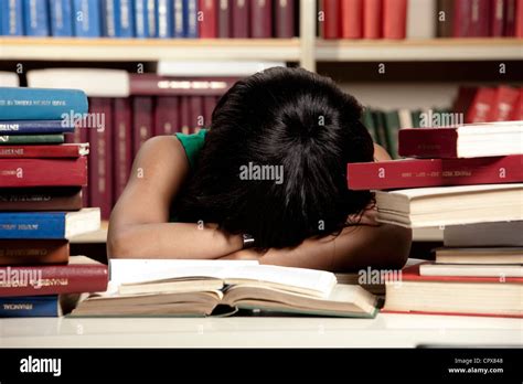Female Student Fallen Asleep On Study Books Stock Photo Alamy