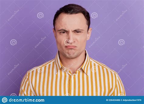 Portrait Of Upset Disgusted Guy Grimace Look Camera Frowning On Purple