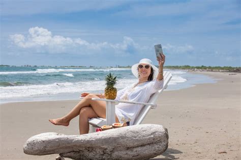 Beautiful Woman Taking Selfies At A Paradisiac Tropical Beach Stock