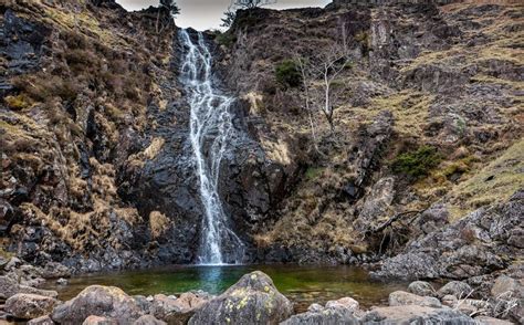 There Is A Small Waterfall In The Middle Of This Rocky Mountain Stream