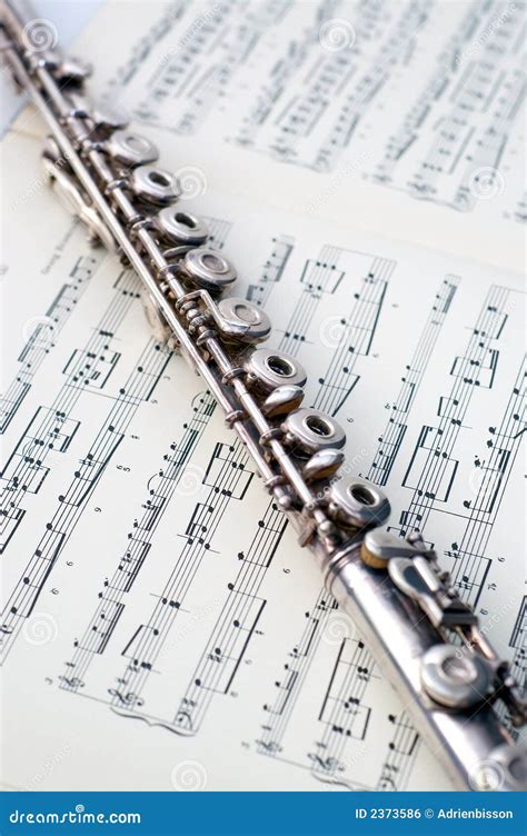A Flute On Sheet Music Stock Photo Image Of Music Band 2373586
