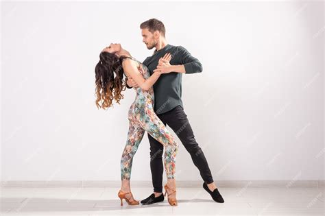 premium photo social dance bachata kizomba zouk tango concept man hugs woman while