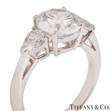Tiffany three stone engagement ring with sapphire side stones in platinum style # 3474. Tiffany & Co. Platinum Diamond Three Stone Ring | Rich Diamonds