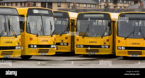 Fleet Of Five 5 Arriva Wales Yellow Painted School Buses Parked In
