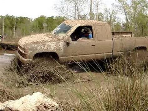 Chevrolet Silverado Lifted Mud Truck Off Roading In The Fun Mud