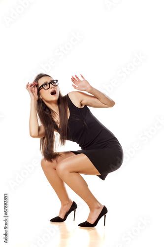 Scared Woman Crouched With Her Hands In The Defenses Position Buy