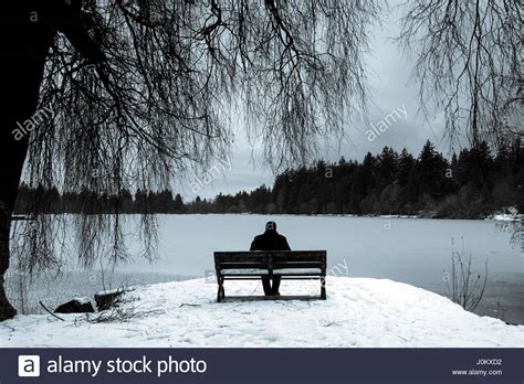 Figure Sitting Alone On Bench Stock Photos And Figure