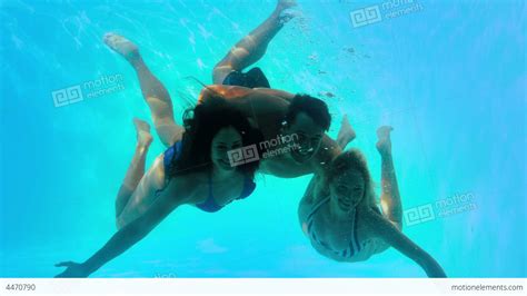 Friends Swimming Underwater In Pool Together Stock Video Footage