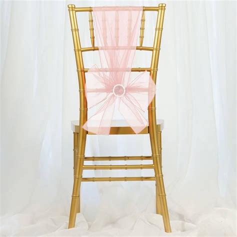 There are many ways to decorate your event chairs. 5 PCS | Sheer Organza Chair Sashes | TableclothsFactory