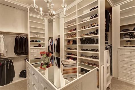Well Appointed White Walk In Closet Features A Mirrored Top White