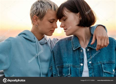 Close Up Of Young Sensual Lesbian Couple Going To Kiss Two Women Enjoying Romantic Moments