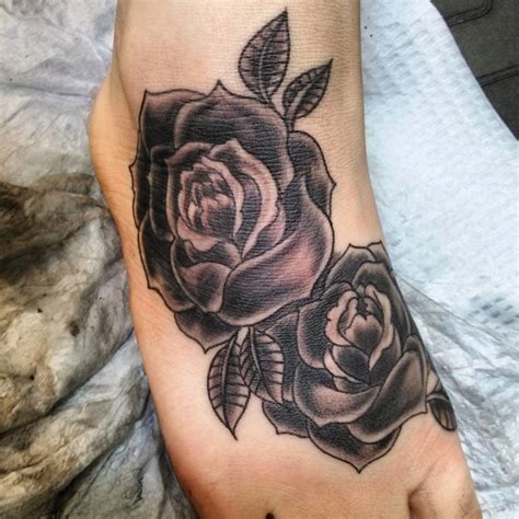 This tattoo is created using a heavy amount of black ink and adorns the wearer's left shoulder. 42 Totally Awesome Black Rose Tattoo That Will Inspire You ...