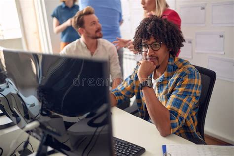 Group Of Young Multiethnic Coworkers Working Together Stock Photo