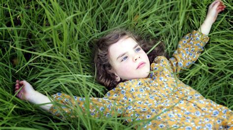 1254878 Hd Small Girl Lying On Grass Rare Gallery Hd Wall Erofound